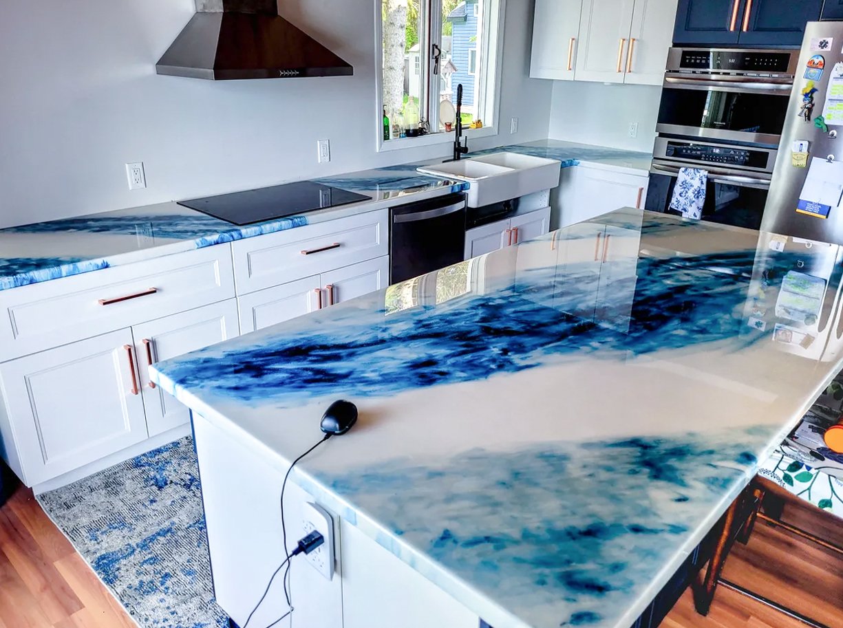 Finished flake broadcast epoxy floor around wooden island cabinetry Finished flake broadcast epoxy floor around wooden island cabinetry