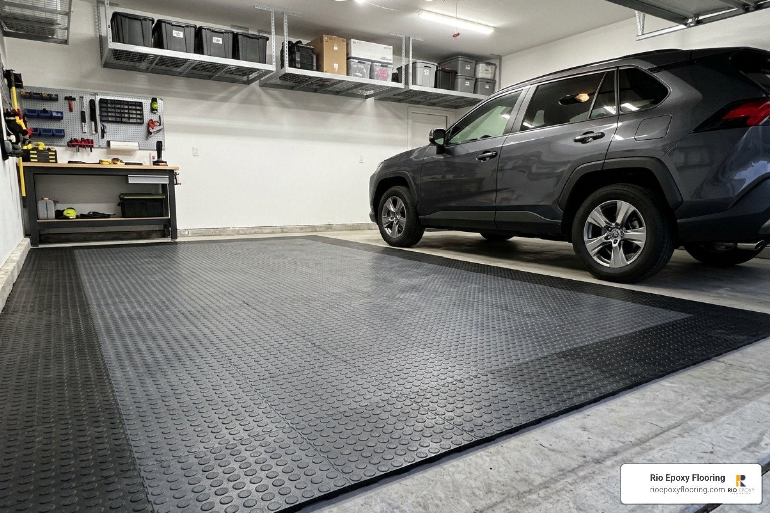 Modular recycled garage tiles interlocking on concrete substrate Modular recycled garage tiles interlocking on concrete substrate